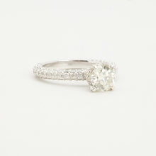 Solitaire ring with pavé shoulders in 14K white gold, Size 8¾.