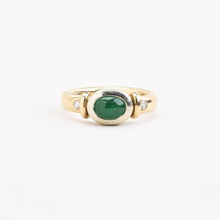 Ring with and emeraldwith diamond (0.06 ct) in 14K Gold and white